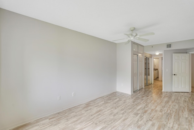 unfurnished room with ceiling fan and light hardwood / wood-style flooring