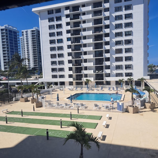 view of swimming pool featuring a patio area