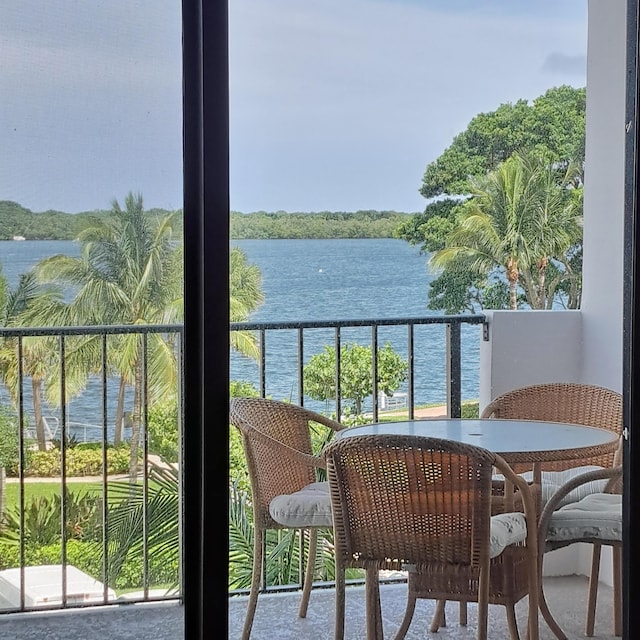 balcony featuring a water view