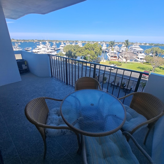 balcony featuring a water view