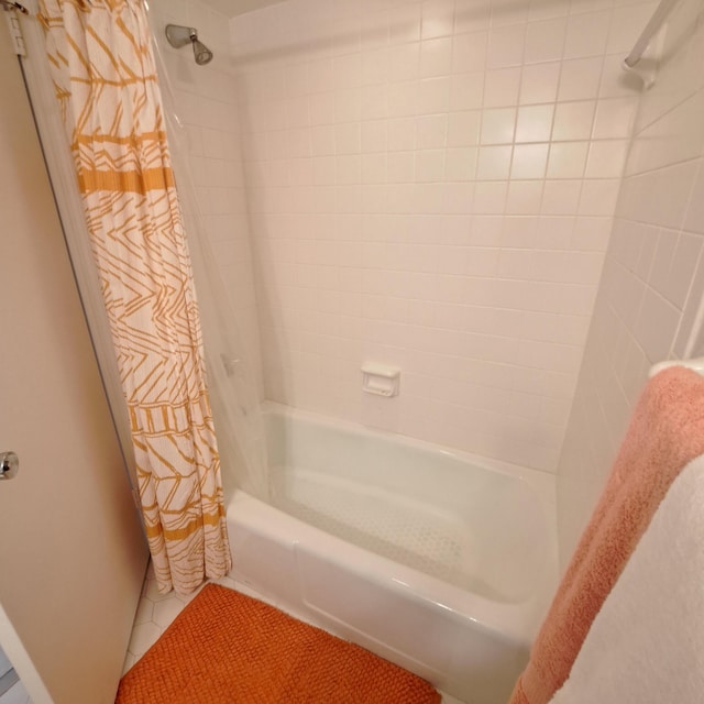 bathroom featuring tile patterned flooring and shower / tub combo