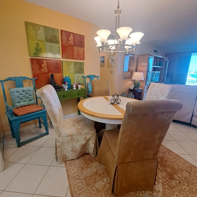 tiled dining space with an inviting chandelier