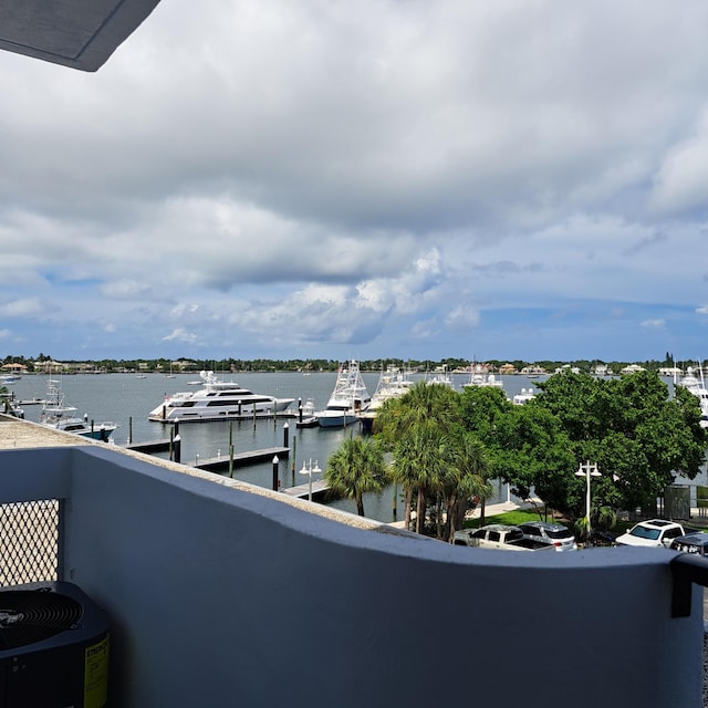 balcony featuring a water view