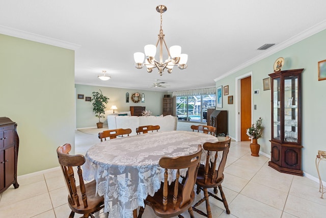 dining area featuring ornamental molding, ceiling fan with notable chandelier, and light tile floors