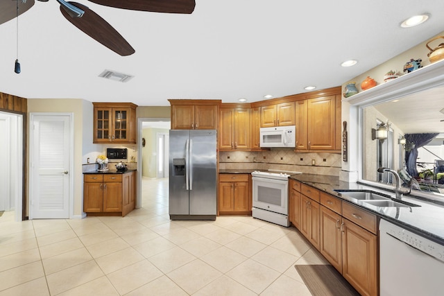 kitchen with ceiling fan, sink, white appliances, tasteful backsplash, and light tile flooring