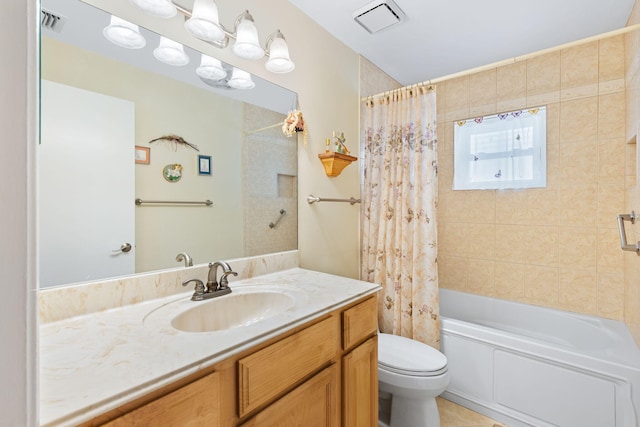 full bathroom featuring tile flooring, vanity, shower / bath combination with curtain, and toilet