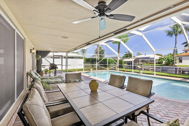 sunroom with ceiling fan and a healthy amount of sunlight