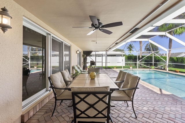 view of terrace with a fenced in pool, ceiling fan, and a lanai