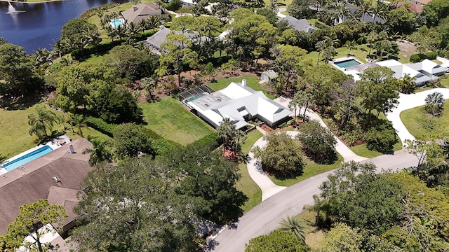 birds eye view of property with a water view