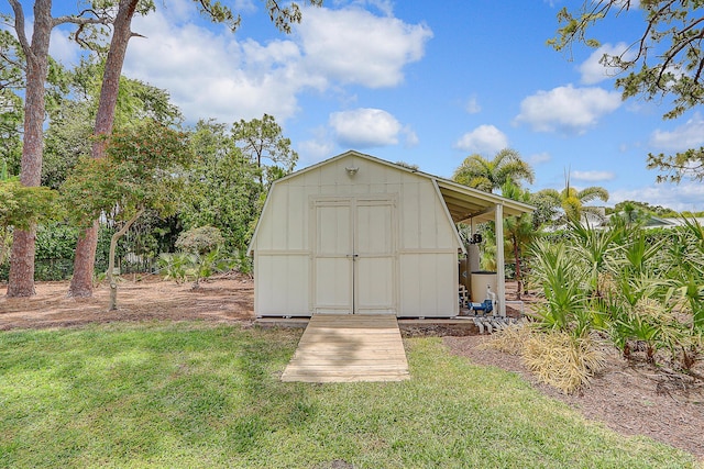 view of outdoor structure with a yard