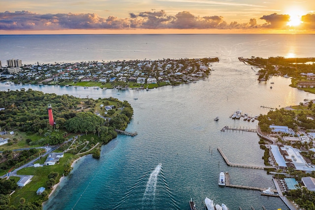 aerial view at dusk with a water view