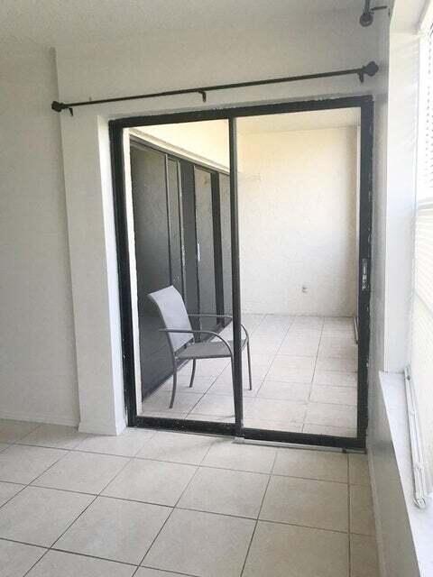 doorway featuring light tile floors