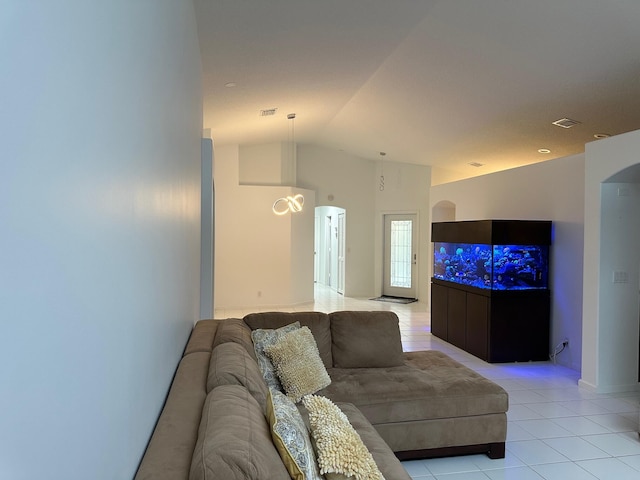 tiled living room with lofted ceiling