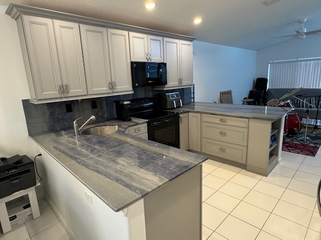 kitchen with ceiling fan, kitchen peninsula, black appliances, tasteful backsplash, and sink