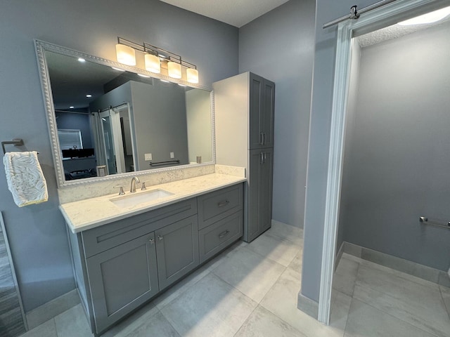 bathroom with vanity and tile patterned flooring