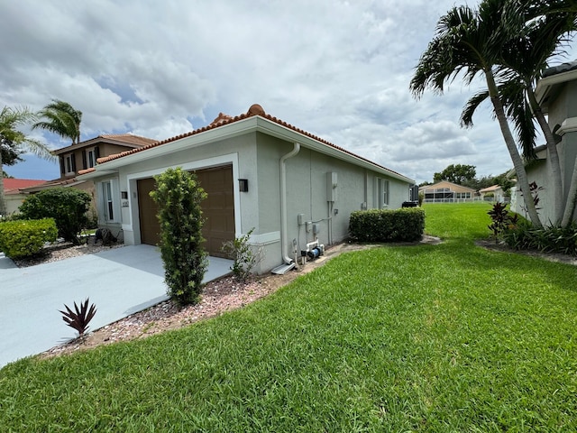 view of property exterior with a lawn and a garage