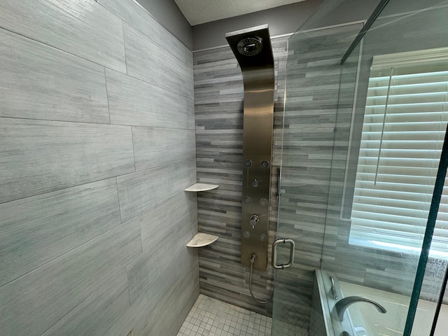 bathroom featuring a shower with door