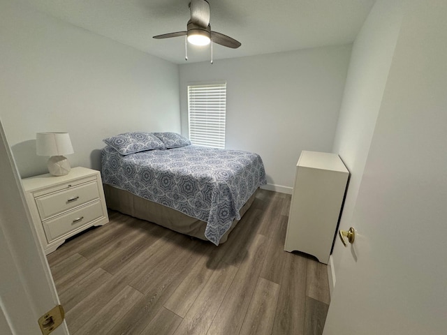 bedroom featuring ceiling fan and hardwood / wood-style flooring