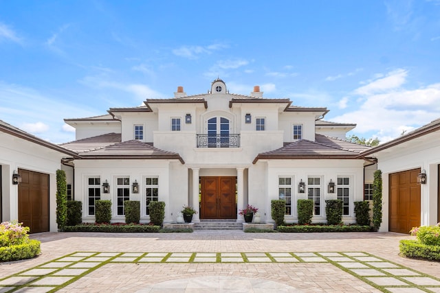 back of property with a garage