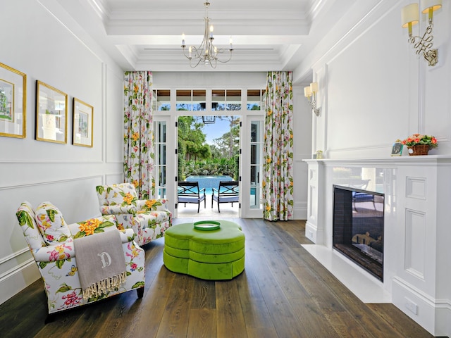 interior space featuring ornamental molding, an inviting chandelier, and dark hardwood / wood-style flooring