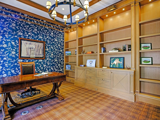 home office with ornamental molding, an inviting chandelier, and built in shelves