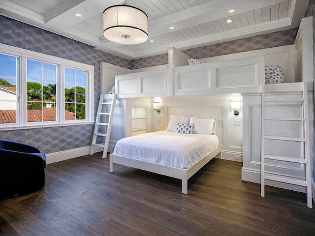 bedroom featuring beamed ceiling, dark hardwood / wood-style flooring, and crown molding