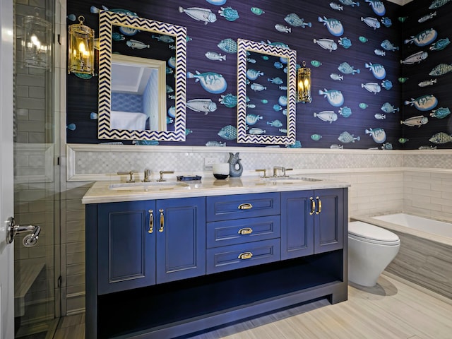 full bathroom featuring double sink vanity, tile walls, tasteful backsplash, toilet, and tile floors