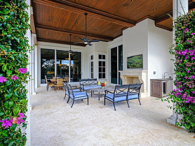 view of patio featuring ceiling fan