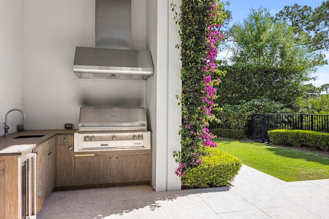 view of patio featuring a grill, sink, and exterior kitchen