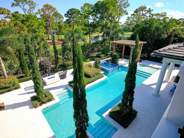 view of swimming pool featuring a pergola and a patio area