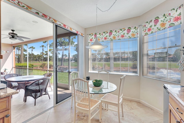 sunroom / solarium with ceiling fan