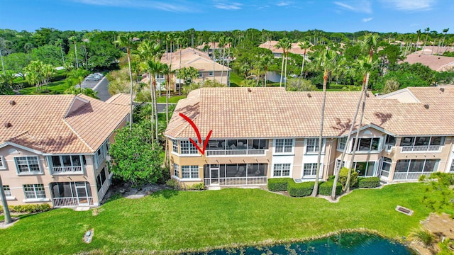 birds eye view of property with a water view