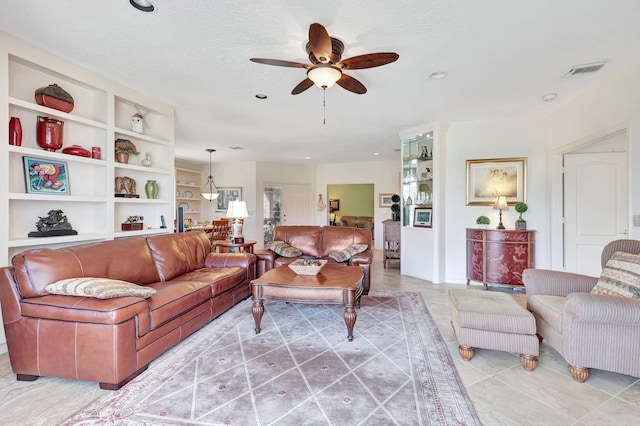 dining area with built in features and light tile floors