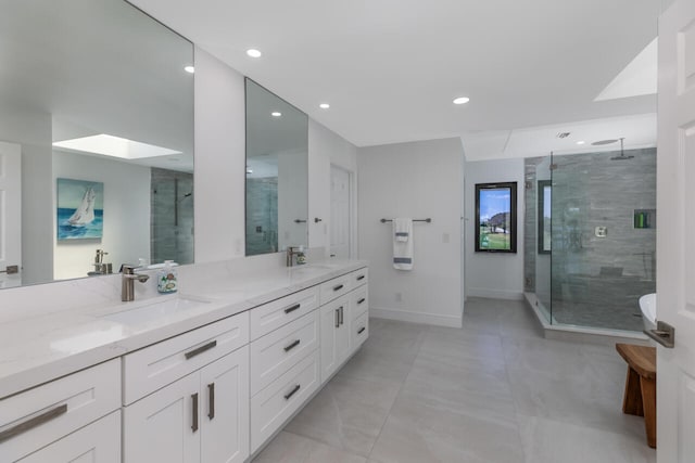 bathroom with double sink vanity, a shower with shower door, and tile flooring