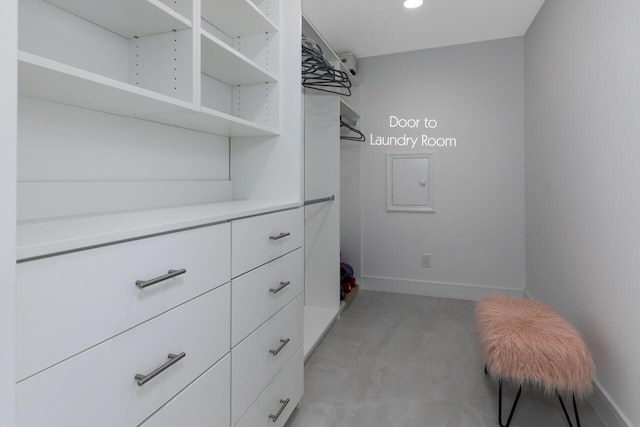 spacious closet featuring light tile floors