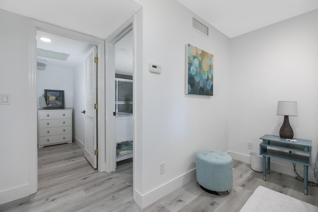 sitting room with light hardwood / wood-style flooring