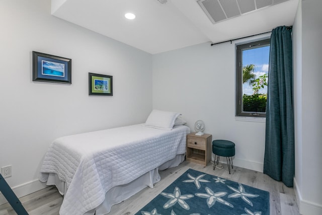 bedroom with light hardwood / wood-style flooring