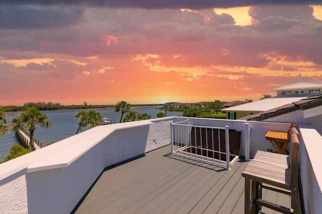 deck at dusk with a water view