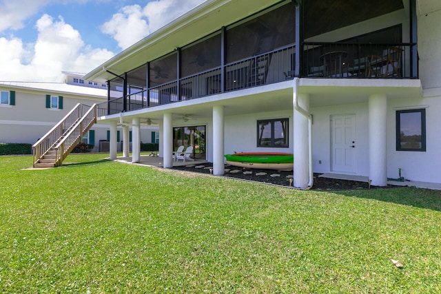 rear view of house with a patio area and a yard