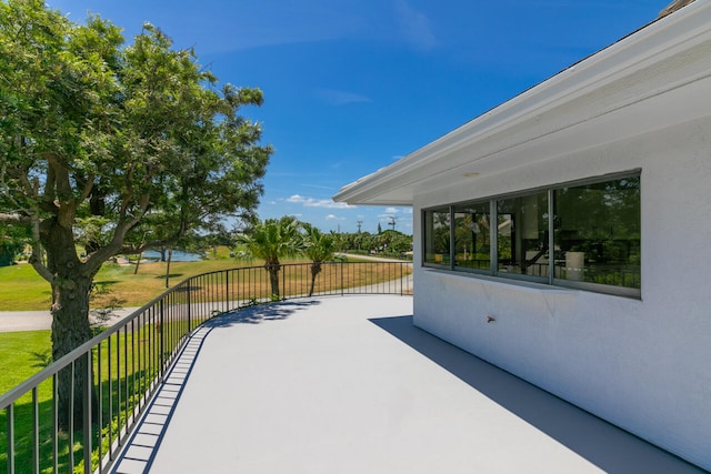 view of patio featuring a balcony