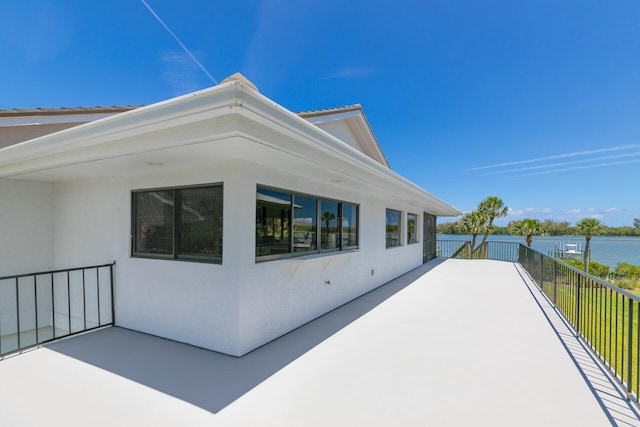 view of home's exterior featuring a water view