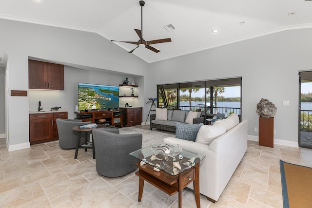 living room featuring ceiling fan, a water view, high vaulted ceiling, light tile flooring, and ornamental molding