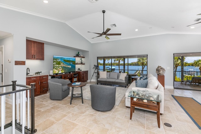 tiled living room featuring a water view, vaulted ceiling, ceiling fan, and crown molding