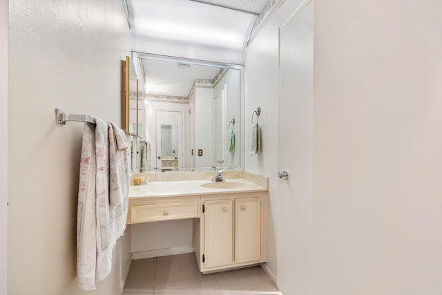 bathroom with tile patterned flooring and vanity