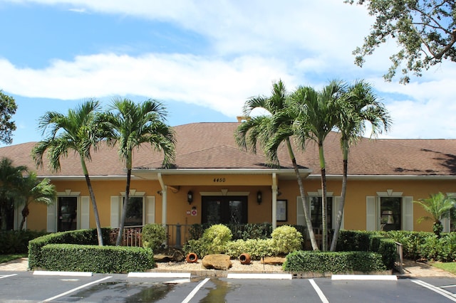 view of building exterior featuring uncovered parking