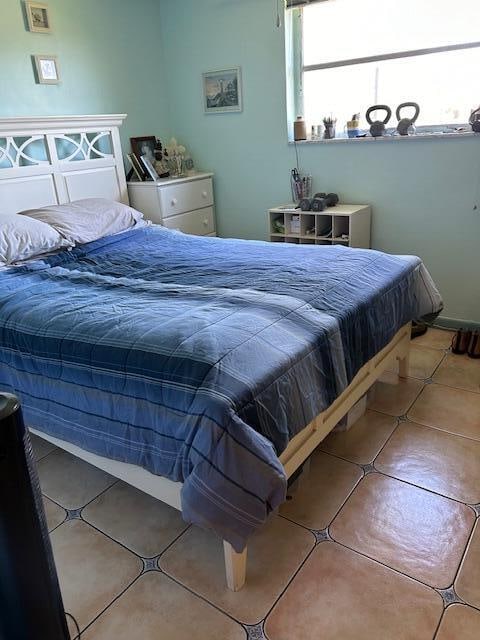 bedroom with tile flooring