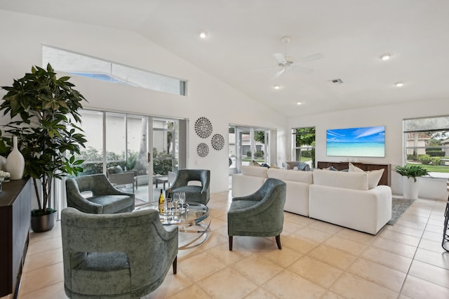 living room featuring a wealth of natural light, ceiling fan, and light tile floors