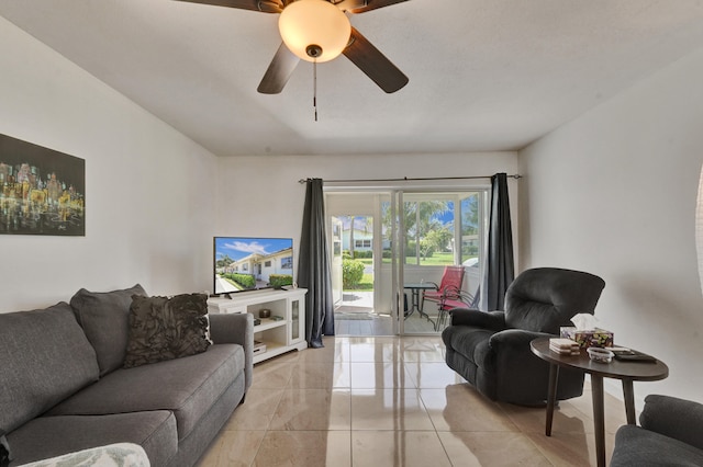 tiled living room featuring ceiling fan