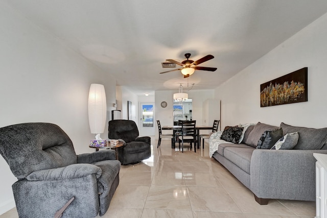 living room with ceiling fan and light tile floors