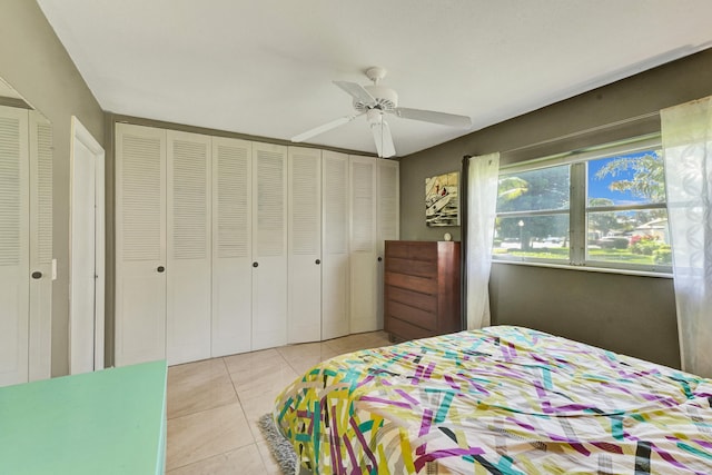 bedroom featuring ceiling fan and light tile floors